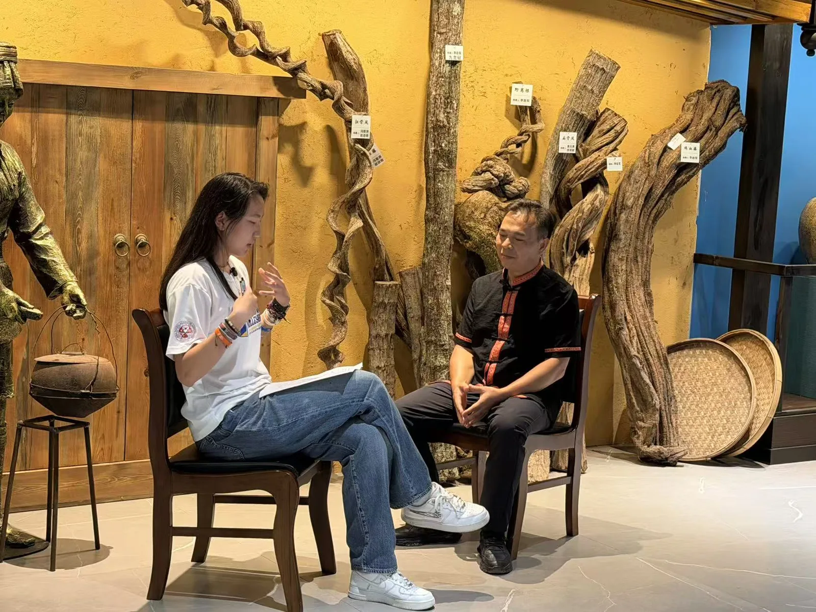 Claire in conversation during the Seeing Yao Medicine fieldwork project.
